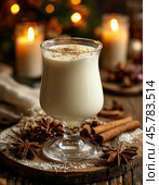 Eg Nog Day is celebrated on December 24. The closest relative of this drink is eggnog. The yolks are beaten with sugar and poured into boiling milk, then spices and (if desired) strong alcohol (rum, brandy, liqueur) are added. This cocktail is considered the traditional "liquid dish" of Christmas, which this holiday cannot do without. Стоковое AI-изображение, AI-художник Сергей Елизарьев / Фотобанк Лори