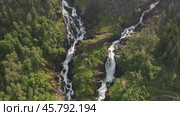 Latefossen is one of the most visited waterfalls in Norway and is located near Skare and Odda in the region Hordaland, Norway. Consists of two separate streams flowing down from the lake Lotevatnet. (2019 год). Стоковое видео, видеограф Андрей Армягов / Фотобанк Лори