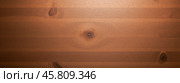 Wooden texture background featuring rich brown tones, visible grain patterns, and natural knots, ideal for use in design projects, presentation. Стоковое AI-изображение, AI-художник Павел Муравьев / Фотобанк Лори
