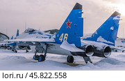 A Soviet multipurpose supersonic fighter. A blue fighter jet in winter at the airfield. The supersonic aircraft is designed to engage and destroy air targets and ground targets. Стоковое фото, фотограф Эдуард Белкин / Фотобанк Лори
