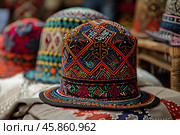 Colorful traditional central asian skullcap embroidered with beads and colorful thread. Стоковое AI-изображение, AI-художник Иван Рябоконь / Фотобанк Лори