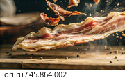 Close up view of roasted bacon. Sliced bacon side view, Hot fried bacon pieces in a cast iron skillet. Closeup slider shot of fresh bacon being flipped on a griddle. Стоковое AI-изображение, AI-художник Анна Сивакова / Фотобанк Лори