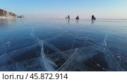 Beautiful blue ice surface of the frozen Lake Baikal near Listvyanka village. Стоковое видео, видеограф Михаил Коханчиков / Фотобанк Лори