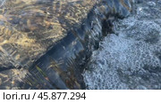 The water is filled with bubbles and he is murky. The bubbles are scattered throughout the water, creating a sense of movement and energy. The water is not clear, but rather has a cloudy. Стоковое видео, видеограф Скрипачев Антон / Фотобанк Лори