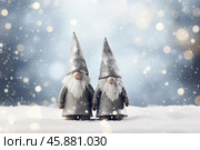 Two christmas gnomes standing in falling snow with sparkling lights. Стоковое AI-изображение, AI-художник Иван Рябоконь / Фотобанк Лори