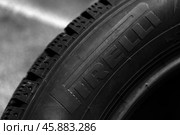 Brand new studded tire by Pirelli. Closeup photo. Редакционное фото, фотограф EugeneSergeev / Фотобанк Лори