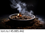 Cigarette butts smoldering in ashtray creating smoke on dark background. Стоковое AI-изображение, AI-художник Иван Рябоконь / Фотобанк Лори