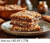 January 8th is Toffee Day. This sweet became popular back in the 17th century and was made, as now, from sugar, butter and milk. Стоковое AI-изображение, AI-художник Сергей Елизарьев / Фотобанк Лори