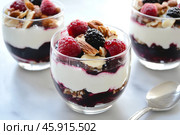 Fresh Berry Trifle in Glasses. Dessert with Raspberries and Whipped Cream. Layered Yogurt with Berry Fruits. Berry Pudding Glass Jars. Food Marketing, Recipe Design. Colorful Sweet Treat. Fruity Quark. Стоковое AI-изображение, AI-художник Марина Демидюк / Фотобанк Лори