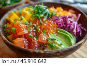 Hawaiian poke bowl with salmon, mango, avocado, tobiko roe, and sesame seeds. Стоковое AI-изображение, AI-художник Иван Рябоконь / Фотобанк Лори