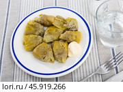 Artichoke cores baked in oven are served with spicy garlic alioli sauce. Стоковое фото, фотограф Яков Филимонов / Фотобанк Лори
