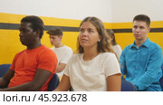 Young woman sitting at desk in classroom of school for taxi drivers. Стоковое видео, видеограф Яков Филимонов / Фотобанк Лори
