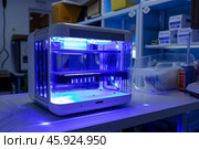 Modern sterilizing medical equipment with ultraviolet light in laboratory. Стоковое AI-изображение, AI-художник Иван Рябоконь / Фотобанк Лори