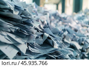 Huge pile of paperwork creating an office mess. Стоковое AI-изображение, AI-художник Иван Рябоконь / Фотобанк Лори