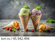 Sweet dessert. Ice cream cones with different flavors on a concrete gray background. World Ice Cream Day. Стоковое AI-изображение, AI-художник Photojuli / Фотобанк Лори