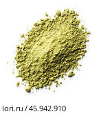 A pile of green powder lying on a white background. The powder has a fine, slightly lumpy texture, reminiscent of crushed leaves or herbs. The color of the substance varies from light green to yellow-green, indicating its natural origin. This powder can be used in cooking, for example, to make matcha teas, smoothies, or as a natural dye. It can also be used for cosmetic purposes, for example, to create face masks, or as a food supplement containing useful microelements. Стоковое AI-изображение, AI-художник Анна Кривицкая / Фотобанк Лори