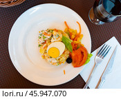 Appetizing Olivier salad with eggs, greens, vegetables, lettuce. Spanish cuisine. Стоковое фото, фотограф Яков Филимонов / Фотобанк Лори