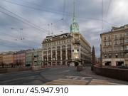 St. Petersburg, Russia, 04.30.2023: View of the historical building of the store "At the Red Bridge" of the Belgian-Dutch trading company "S.Esders and K.Scheifals" on the Moika River embankment. Редакционное фото, фотограф Ula Ulachka / Фотобанк Лори