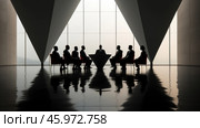 Modern conference room with minimalist design. In the center of the room, people dressed in business suits are sitting at a table in the shape of an inverted cone. Behind them are large windows through which soft diffused light passes. The floor is glossy, reflecting the figures of the participants and furniture, creating an effect of symmetry. The atmosphere looks official, emphasizing the importance of the topic being discussed. Strict lines and geometric shapes prevail in the room. Стоковое AI-изображение, AI-художник Анна Кривицкая / Фотобанк Лори