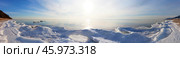 Baikal Lake on January morning. Panoramic view of coast with white ice floes during freeze-up period on sunrise. Beautiful landscape of calm lake in sunlight. Natural background. Winter travels and outdoors. Стоковое фото, фотограф Виктория Катьянова / Фотобанк Лори