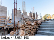 Construction site, residential building build, metal armature concrete structure. Стоковое фото, фотограф Spirit River / Фотобанк Лори