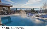 Warm pool steaming in snowy mountain resort. Стоковое AI-видео, аниматор Юрий Поздников / Фотобанк Лори