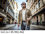 Disability. Loss of vision. A blind man with a cane and dark glasses is walking along a city street. International Day of the Blind on November 13. Стоковое AI-изображение, AI-художник Photojuli / Фотобанк Лори