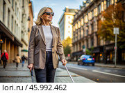 Disability. Loss of vision. A blind woman with a cane and sunglasses is walking down a city street. International Day of the Blind on November 13. Стоковое AI-изображение, AI-художник Photojuli / Фотобанк Лори