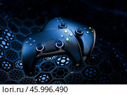 Blockchain game concept. Gamepad on dark background and empty space for design. Esports. Video games. Gaming joystick on technological background. Finance in games. 3D rendering. Стоковая иллюстрация, иллюстратор Alexander / Фотобанк Лори