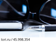 Notebook, pencil and glasses. Стоковое фото, фотограф Сергей Толмачёв / Фотобанк Лори