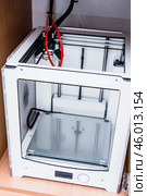3d printer with bright red filament. Стоковое фото, фотограф Сергей Толмачёв / Фотобанк Лори