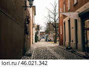 Klaipeda, Lithuania, February 2019, City street cloudy rainy day, little town. Стоковое фото, фотограф Spirit River / Фотобанк Лори