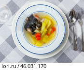 Salmon offal soup with potatoes, carrots and parsley closeup. Стоковое фото, фотограф Яков Филимонов / Фотобанк Лори