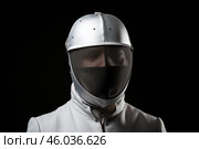Fencer wearing protective mask and uniform on black background. Стоковое AI-изображение, AI-художник Иван Рябоконь / Фотобанк Лори