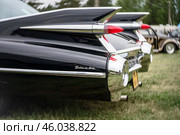 FINOWFURT, GERMANY - MAY 11, 2024: The fragment of full-size luxury car Cadillac Sedan DeVille. Art lens. Swirl bokeh. Season opening of Race 61 Festival. Редакционное фото, фотограф Sergey Kohl / Фотобанк Лори