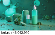 Green bottle of lotion sits on a table next to a green bottle of nail polish. Стоковое AI-видео, аниматор Sergey Grishin / Фотобанк Лори