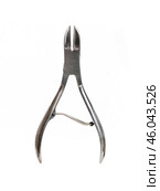 A pair of stainless steel nail clippers for manicure and a pedicure isolated on a white background. Стоковое фото, фотограф Елена  Попкова / Фотобанк Лори