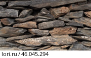 Stunning Natural Stone Wall Crafted with Beautifully Textured Slate Layers for Visual Appeal. Стоковое видео, видеограф PAv / Фотобанк Лори