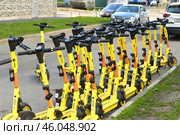 Moscow, Russia - June 6. 2023 Short-term rental service for electric scooters Yandex Go. Редакционное фото, фотограф Володина Ольга / Фотобанк Лори