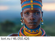 Indigenous woman wearing traditional colorful beaded jewelry and headband. Стоковое AI-изображение, AI-художник Иван Рябоконь / Фотобанк Лори