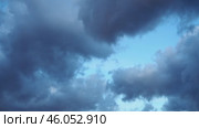 Heavy clouds fill the sky, signaling an impending storm. The atmospheric change creates a dramatic backdrop as daylight wanes, hinting at rain on the horizon. Стоковое видео, видеограф Юлия Петровская / Фотобанк Лори
