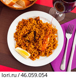 Paella with seafood served in a plate. Стоковое фото, фотограф Яков Филимонов / Фотобанк Лори