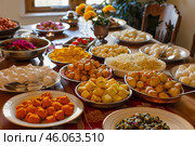 Festive prasadam dishes displayed on table for krishna lunch feast. Стоковое AI-изображение, AI-художник Иван Рябоконь / Фотобанк Лори