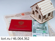 Удостоверение адвоката на фоне доверенности, денег и домика. Стоковое фото, фотограф fotobelstar / Фотобанк Лори