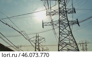 Overhead line pylons, high voltage pylons. Power transmission towers and lines at sunset. A shot of high voltage electric transmission tower, also known as electricity pylon. Стоковое видео, видеограф ALLA YURTAYEVA / Фотобанк Лори