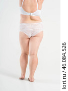 Overweight thigh, woman with fat hips, buttocks and varicose veins, obesity female body with cellulite on gray background. Стоковое фото, фотограф Станислав Тарко / Фотобанк Лори