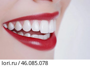 Beautiful Smile. Female smiling, perfect white teeth, close up. Healthy smiles. Perfect teeth of smiling young woman on a white background. Whitening. Dental clinic patient. Oral care, dentistry. Стоковое AI-изображение, AI-художник Марина Демидюк / Фотобанк Лори