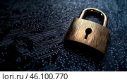 A gold colored lock with a keyhole sits on a black surface. Стоковое AI-изображение, AI-художник Ярославский Максим / Фотобанк Лори