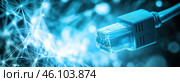 A close-up of an RJ-45 network cable, symbolizing an internet connection. The cable is in blue tones, creating a sense of technology and the digital world. The background is blurred, with abstract lines and glowing patterns resembling a network of connections, which is associated with data transfer, internet communications and digital infrastructure. This visual style is often used in concepts related to the internet, cyberspace and high technology. Стоковое AI-изображение, AI-художник Анна Кривицкая / Фотобанк Лори