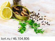 Marinated chipirones in ink with greens and lemon. Стоковое фото, фотограф Яков Филимонов / Фотобанк Лори